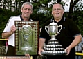 TROPHY TIME: Steve Copeland (left) and Alan Hodson show off their silverware. 