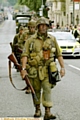 ALL kitted out . . . uniformed soldiers 
