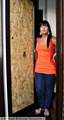 FEARFUL: Maxine Jones and the damaged front door 
