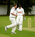 WERNETH’S Matthew Taylor celebrates after team-mate Joe Taylor claims the wicket of Littleborough’s Warron Williams, who trudges off.  