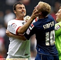 FLASHPOINT . . . Antony Kay, who was sent off, grabs Latics striker Robbie Simpson by the face.  