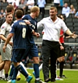 Karl Robinson (right) has a word with Athletic’s Robbie Simpson in the aftermath of the MK Dons clash.