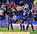 YOU BEAUT: Athletic midfield man Youssouf Mchangama is congratulated by his team-mates after opening the scoring. 