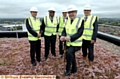 COMPLETED: trust chairman John Jesky plants the final piece of turf on the roof-top eco-garden, with (from left) neonatal lead nurse Ian Yates, clinical director Olubusola Amu, and Vince Boodea and Colin Rankin of Vinci Construction. 