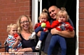 HOME sweet home: (right) Rebecca and Stephen with triplets (from left) Archie, Grace and Isabelle outside their newly-renovated home 
