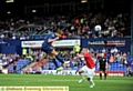 James Tarkowski powers in a header at goal 