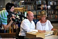 Action: the cameraman moves in to see what Corrie star Anne and Chronicle editor David Whaley are looking at in the Chronicle archive. 
