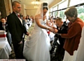 MAGIC moment: Adam passes the rings to mum Anita watched by bridegroom Adam Claxton 
