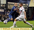 GET BACK . . . Athletic’s Lee Croft attempts to force his way down the by-line. 