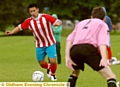ON THE ATTACK . . . Crompton House player Jeffrey Ho, formerly of Manchester City and Stoke, takes the game to Willow Tavern. 