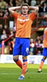 SO CLOSE: Matt Smith reacts after being denied by Brentford goalkeeper Simon Moore. 