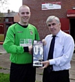PRIZE GUY. . . Chadderton’s Dale Latham receives his goalkeeper of the month award from Geoff Wilkinson of the North-West Counties League. 