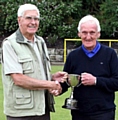 SPRINGHEAD’S Terry Rogers (far right) receives the Veterans’ League’s President’s Cup from the president, Bill Connolly, after his 21-18 victory over team-mate John Thornley in the final at Royton Cricket Club. 