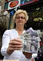 TAKE note: staff member at Uppermill Post Office, Karen Kilgannon, with the forgeries 
