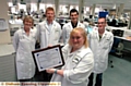 WE’VE done it: Lyn Cooper displays the Nadcap accreditation certificate with colleagues (left-right) Ann Sharphouse, Ash Lomas, Paul Cox and Andrew Woodhead 
