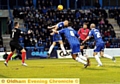 IT’S THERE: Michael Petrasso loops a header past Gills’ ’keeper Stuart Nelson for the only goal. 