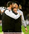 Athletic manager Paul Dickov gets a hug from goalkeeping coach Paul Gerrard after victory over Liverpool. 