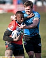 TIGHT TUSSLE: Oldham’s Mo Agoro pushes off a defender. 