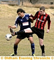 CLOSE QUARTERS . . . Uppermill's Joe Longmoor (right) makes a challenge 
