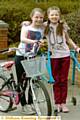 SISTERS in arms . . . Katie (10), left, and Ellen (12) 
