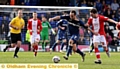 Athletic winger Lee Croft gets a tug on his shirt as he tries to set up an attack. 