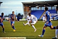 ATHLETIC’S Bobby Reid tries to guide his shot through the Shrewsbury defence in last night’s League Once clash. 