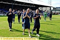 Players show their appreciation to the crowd at the end of the Crawley game 