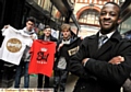 Eric Bishykia (front) on his T-shirt stall with Bradley Duffy, Elliot Hawkins and Jack Phillips. 