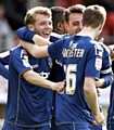 FEELGOOD FACTOR:Kirk Millar and team mates celebrate his equalising goal. 