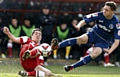 GETTING STUCK IN . . . Athletic youngster Danny Gosset (right) challenges Leyton Orient’s Lloyd James at Brisbane Road on Saturday. 
