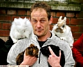 FLUFFY Foursome . . . Mark Hilton with the rescued rabbits and guinea pigs. 