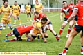 Jon Ford and Josh Crowley combine to stop Hemel Stags’ Mason Caton-Brown. 