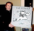 Inspiral Carpets' Clint Boon and his painting of the band's famous cow logo 

