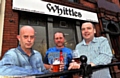 CHEERS . . . the new owners of Whittles, from left, John Dodd, Martin Schofield and Neil Haughton 
