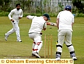 CLEANED UP . . . Glodwick batsman Brad Heap is bowled by Austerlands hero Imran Aslam. 