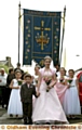 Rose Queen Melissa Taylor, from St Thomas’s in Lees, accompanied by her retinue and Lukas Briggs 
