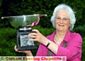 FLASHBACK: Sheila Cooper hoists the Chronicle Cup after last year’s win. 
