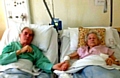 TOGETHER again . . . nursing staff are making sure Derek and Gladys Pye get to see each other regularly while they recover 
