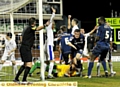 Oldham Athletic's Matt Smith (centre) celebrates scoring his teams second goal of the game during the FA Cup fifth round match at Boundary Park, Oldham. 