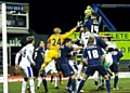 RAISE THE ROOF.. Matt Smith climbs high to score a last-gasp equaliser against Everton. 