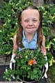 Casey Diveney (7) gets her green fingers dirty for the cause 
