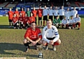 LINE UP . . . Captains Andrew Walker (Rifle Range, left) and Jamie Hill (Crompton House) front up their teams before last night’s final 
