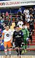 HAT-TRICK hero: Latics boss Lee Johnson (front, right) leads out the Legends. 