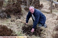 DANGER: concerned Ray Taylor uncovers a mine shaft on Crompton Moor 