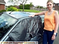 SHOCK . . . Rachel Bullock and the damaged car 

