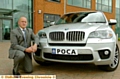 DCI Rick Jackson with a BMW X5 seized by police 