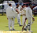 THAT’S OUT: Heyside batsman Tony Heaton walks as Greenfield bowler Alex Peters and Peter Gill celebrate during their clash last weekend. 