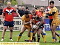 UNDER PRESSURE: Oldham’s David Cookson holds possession. 