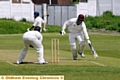 Ashton batsman Janak Patel beats the ball as Royton bowler Chris Hutchinson looks on. 