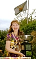 GLYNIS Jones shows off the Chronicle Cup as the flies at half mast behind her. 